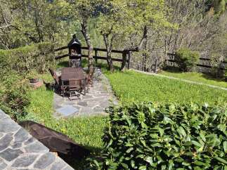 This outdoor dining area is perfect for enjoying meals and hosting barbecues.