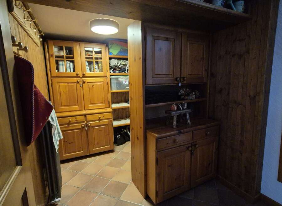 Step into a world of rustic charm with this property's beautiful wooden cabinetry and warm terracotta tiled floors.