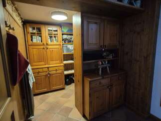 Step into a world of rustic charm with this property's beautiful wooden cabinetry and warm terracotta tiled floors.