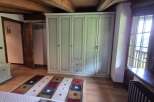 This charming bedroom features a spacious wardrobe, offering ample storage.