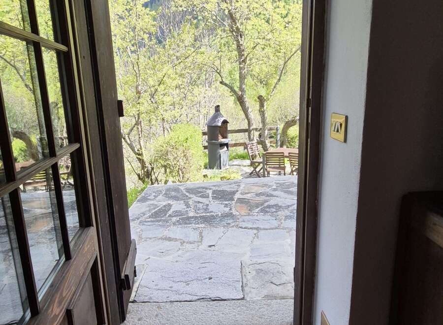 Step into serenity with this property featuring an inviting entrance that opens to a picturesque outdoor patio.