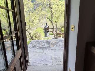 Step into serenity with this property featuring an inviting entrance that opens to a picturesque outdoor patio.