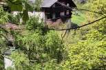 Nestled among lush greenery, this charming property offers tranquility and privacy.