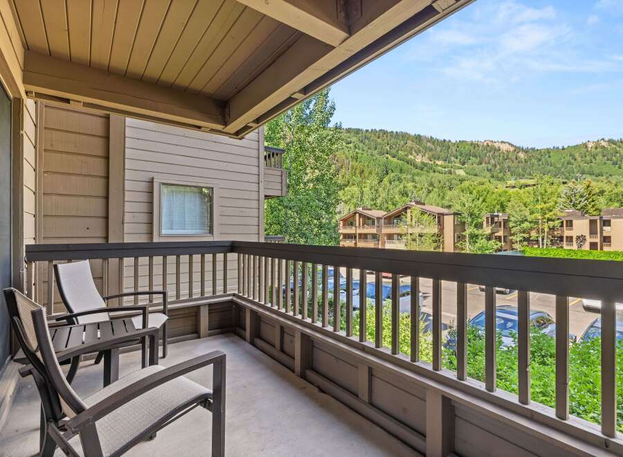 Enjoy the outdoors from this condo's private balcony.