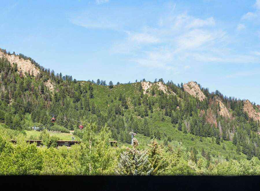 Nestled within a lush, green mountain landscape, this property offers unparalleled access to nature and scenic views.