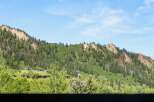 Nestled within a lush, green mountain landscape, this property offers unparalleled access to nature and scenic views.