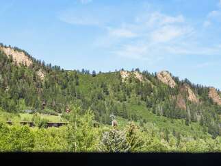 Nestled within a lush, green mountain landscape, this property offers unparalleled access to nature and scenic views.