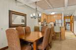This inviting dining area seamlessly connects to a well-equipped kitchen, creating an ideal space for entertaining.