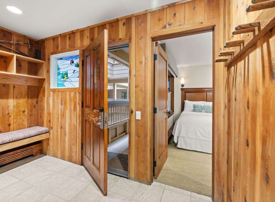 Step inside this charming property featuring beautiful wood-paneled walls that create a warm, rustic ambiance.