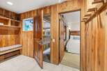 Step inside this charming property featuring beautiful wood-paneled walls that create a warm, rustic ambiance.