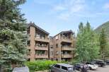 Discover the charm of this multi-story condo nestled amidst lush greenery.