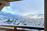 Escape to this luxurious ski chalet with breathtaking mountain views.