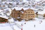 Luxury ski chalet offering stunning mountain views and ski-in/ski-out access.