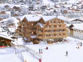 Luxury ski chalet offering stunning mountain views and ski-in/ski-out access.