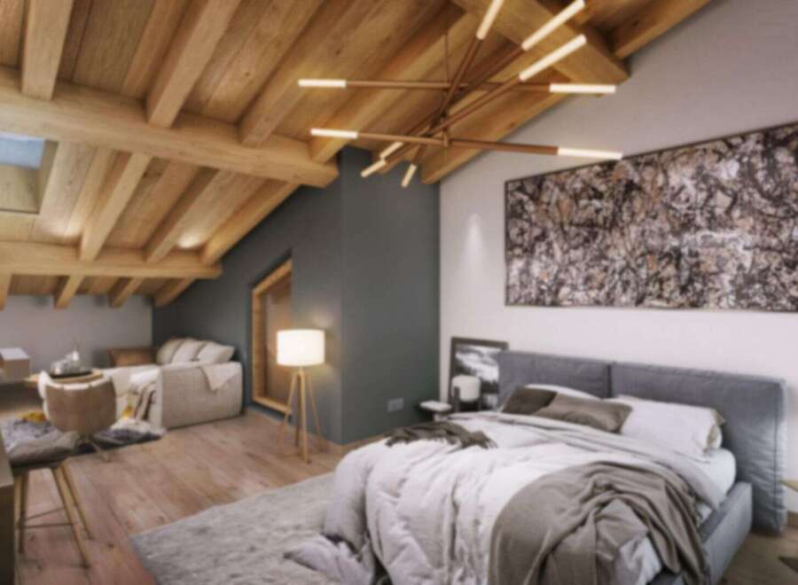 Discover a luxurious attic bedroom in this stunning property.