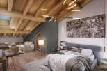 Discover a luxurious attic bedroom in this stunning property.