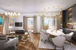 This luxurious living space boasts an open floor plan, seamlessly connecting the living, dining, and kitchen areas.