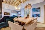 Step inside this stunning property featuring an open-concept living space with vaulted wood ceilings.