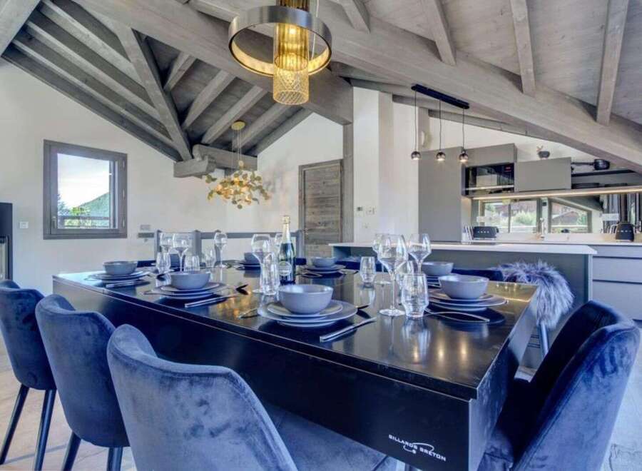 Step into luxury with this stunning property showcasing a dining area perfect for entertaining.