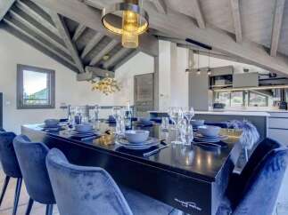Step into luxury with this stunning property showcasing a dining area perfect for entertaining.