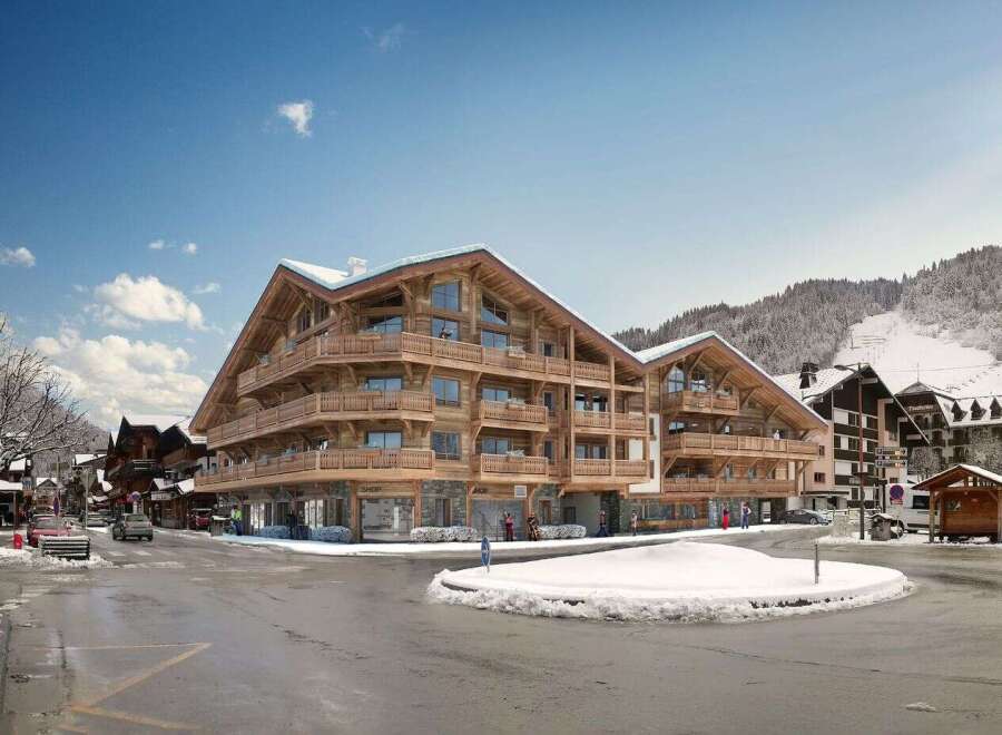 Discover luxury living in this stunning wooden chalet-style apartment building, perfectly situated in a picturesque snowy mountain town.