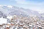 Discover luxury real estate in a winter wonderland with stunning mountain views.