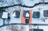 This property offers a serene winter retreat with a home nestled amidst snow-covered landscapes.