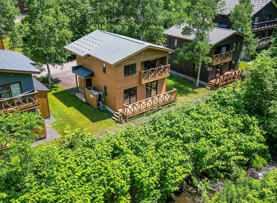 Discover this charming chalet nestled amongst lush greenery.