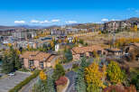Luxury real estate in a mountain resort town boasts stunning views and autumn foliage.