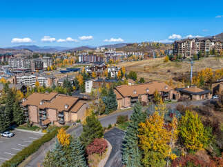 Luxury real estate in a mountain resort town boasts stunning views and autumn foliage.