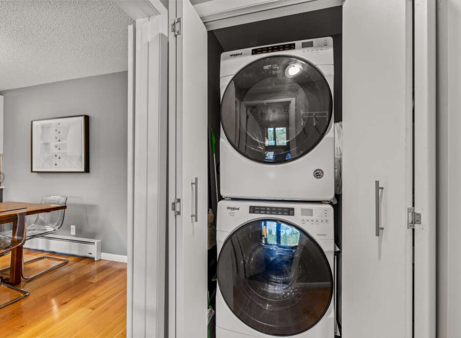 This property features a convenient laundry closet with a stacked washer and dryer, maximizing space in your home.