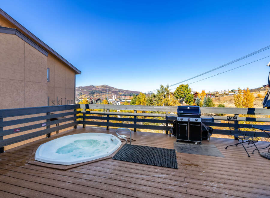 Enjoy the ultimate relaxation on the deck of this mountain retreat.
