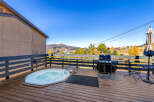Enjoy the ultimate relaxation on the deck of this mountain retreat.