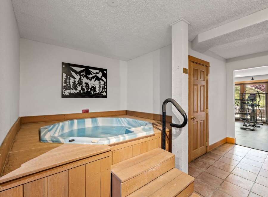 Relax and rejuvenate in this home's luxurious spa area, featuring a hot tub for ultimate relaxation.