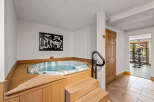 Relax and rejuvenate in this home's luxurious spa area, featuring a hot tub for ultimate relaxation.
