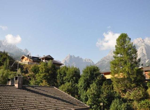 Discover mountain properties with breathtaking views! This charming home offers a serene escape surrounded by lush greenery and majestic mountains.