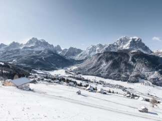 Discover the charm of mountain living with this stunning property nestled in a snow-covered valley.