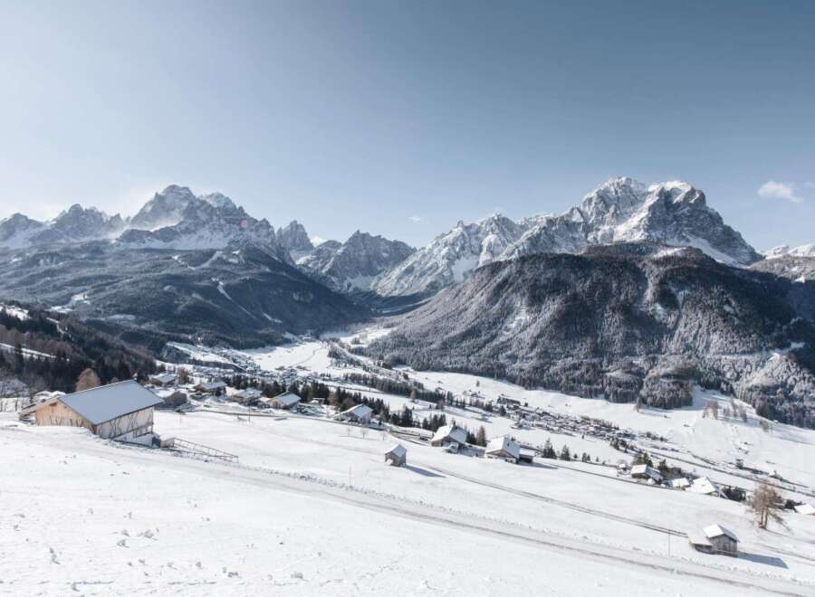 Discover the charm of mountain living with this stunning property nestled in a snow-covered valley.