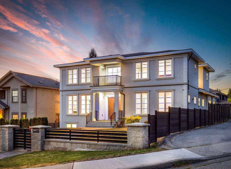 This stunning two-story home boasts a modern exterior with elegant architectural details.