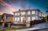 This stunning two-story home boasts a modern exterior with elegant architectural details.