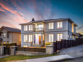 This stunning two-story home boasts a modern exterior with elegant architectural details.