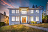 This is a two-story house boasts a stunning exterior with a balcony, complemented by a meticulously maintained lawn.