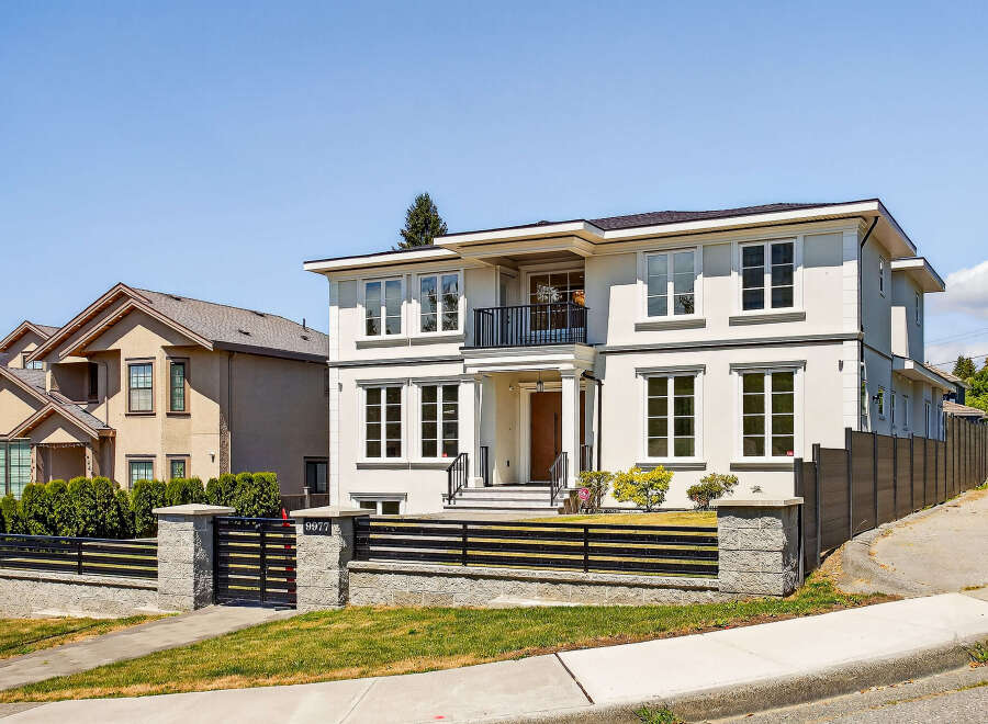 This is a beautifully designed two-story home with a modern aesthetic.