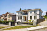 This is a beautifully designed two-story home with a modern aesthetic.