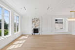 This stunning property boasts a bright and airy living space, accentuated by large windows and gleaming hardwood floors.