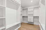 This is a spacious walk-in closet designed for optimal organization.