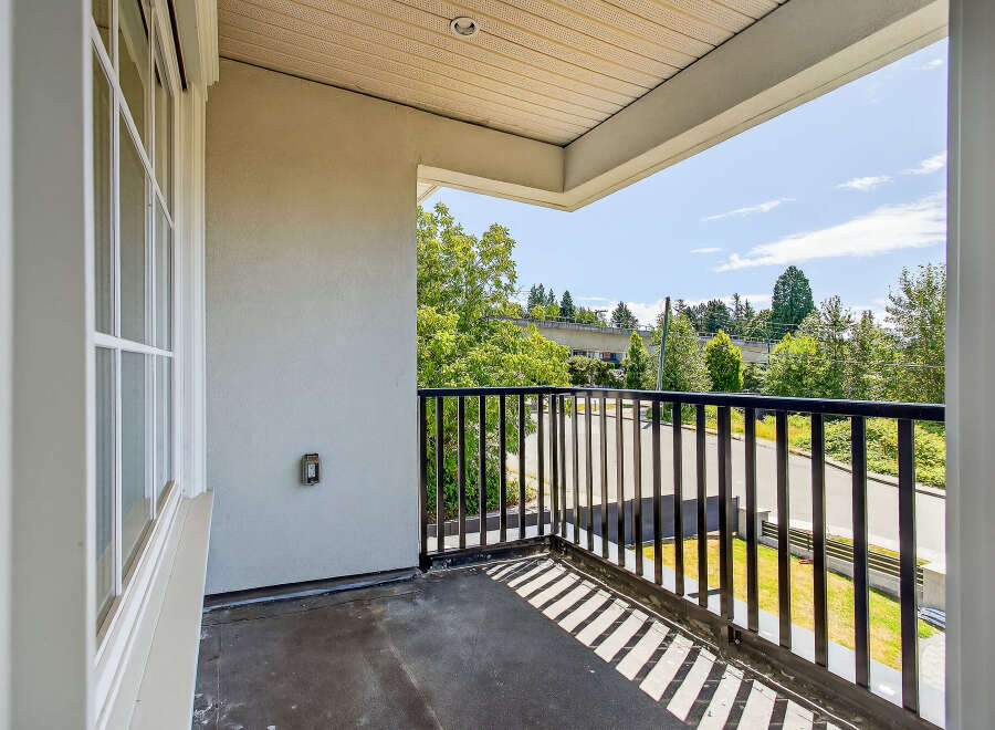 Enjoy the outdoors from this private balcony, perfect for relaxing and entertaining.
