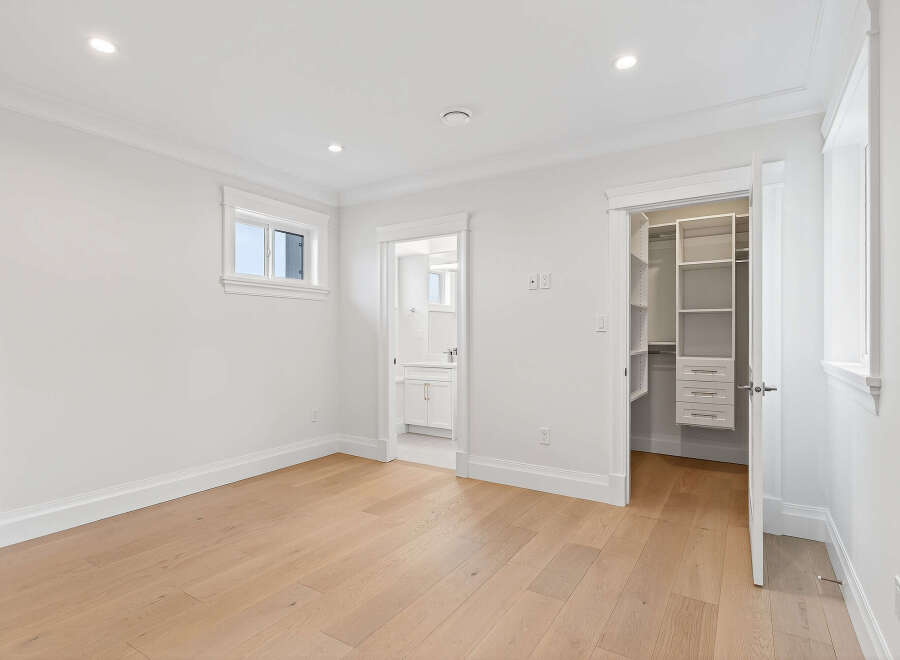 This bright and airy bedroom offers a clean, modern aesthetic perfect for relaxation.