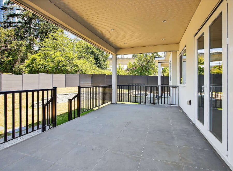 This expansive patio offers a seamless transition from indoor to outdoor living.