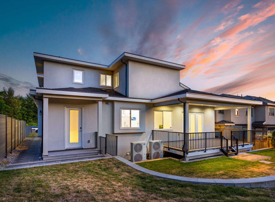 Stunning modern home with a spacious backyard, perfect for outdoor entertaining.